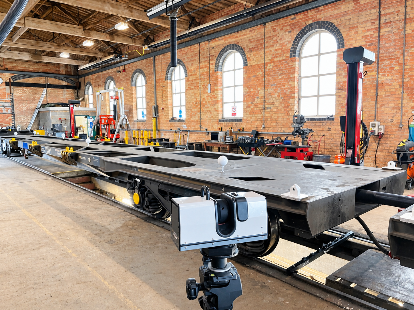 Engineer using a 3D scanner to capture a rail vehicle